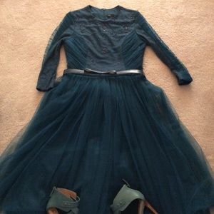 Beautiful green belted dress with tulle bottom.